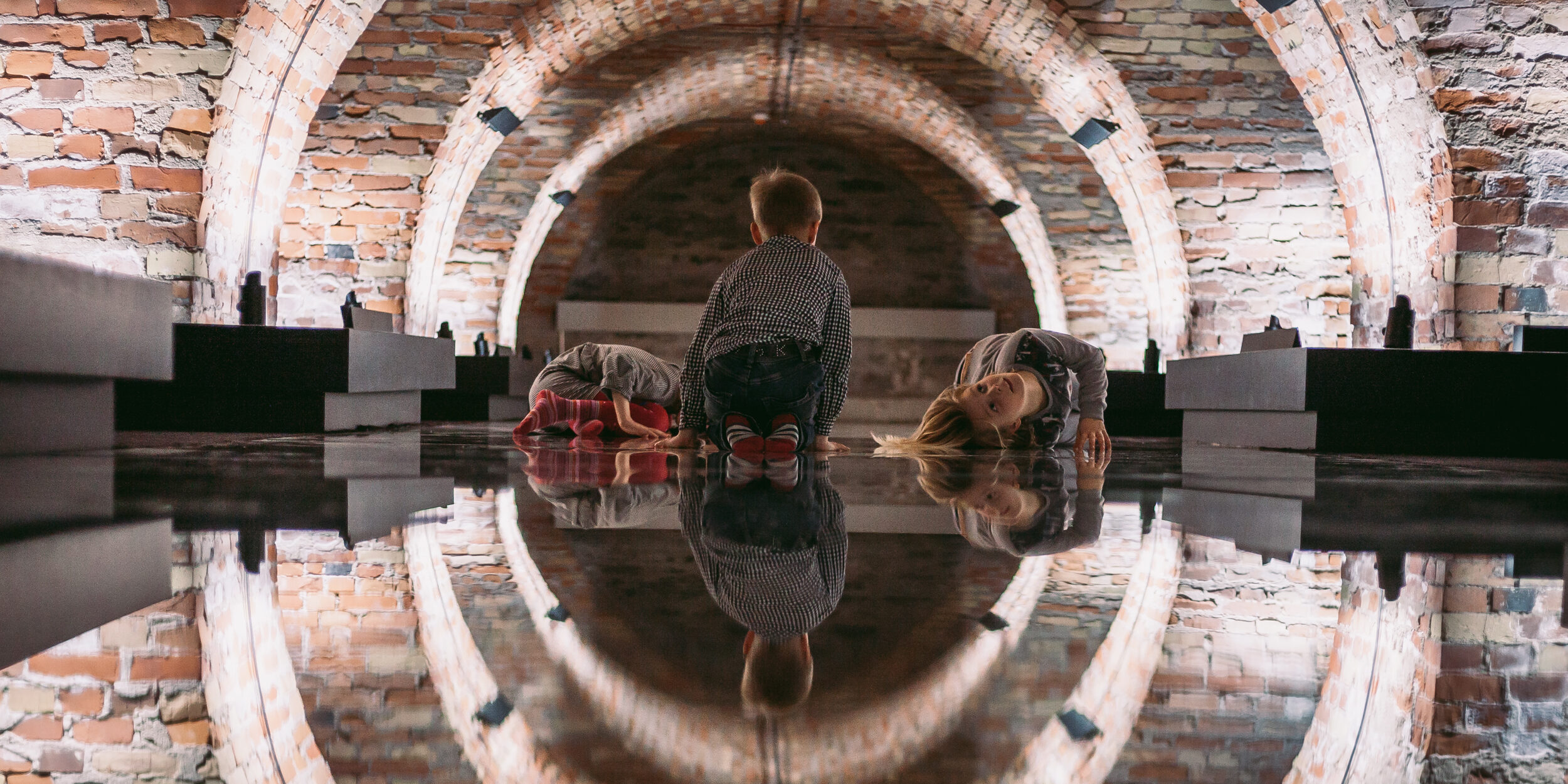 Kids playing on a mirrored floor