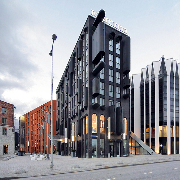 A contemporary building made of black bricks